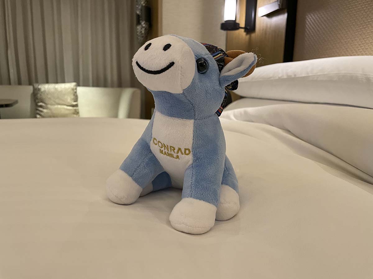 Stuffed animal on my bed at the Conrad Manila Hotel
