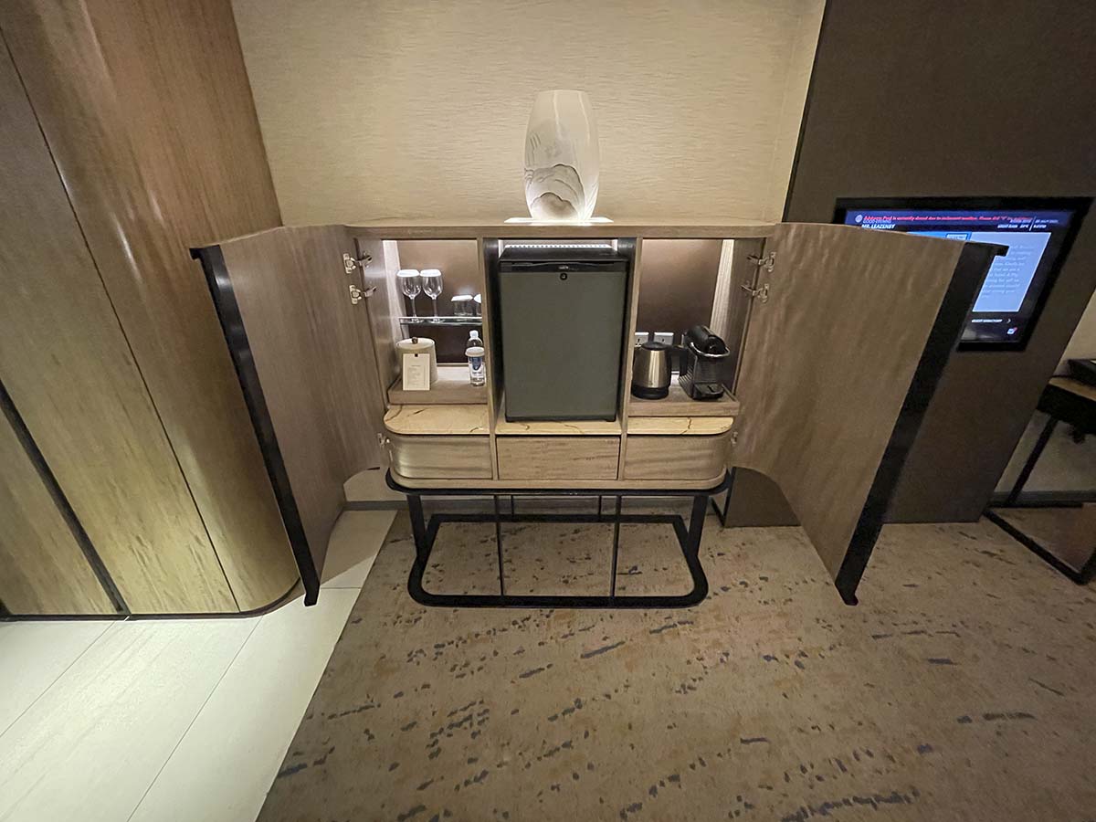Cabinet containing mini bar and drinks in my room at the Conrad Manila Hotel 