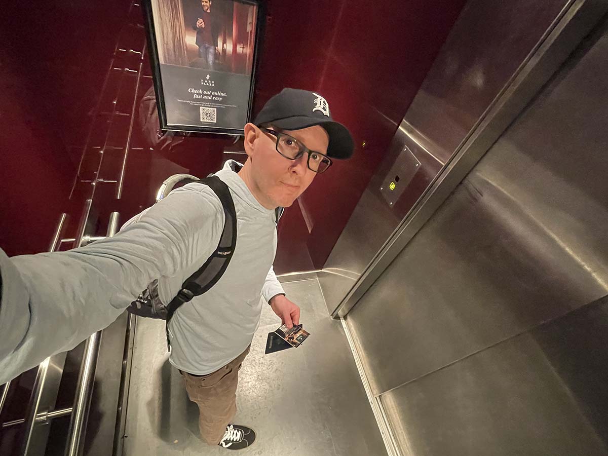 Scott riding the elevator up to his room at the Park Plaza Victoria Hotel Amsterdam
