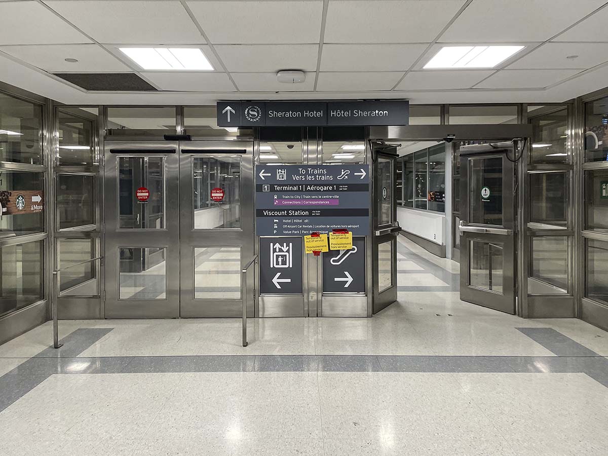 Signs pointing to the Sheraton hotel in the Toronto Pearson international airport