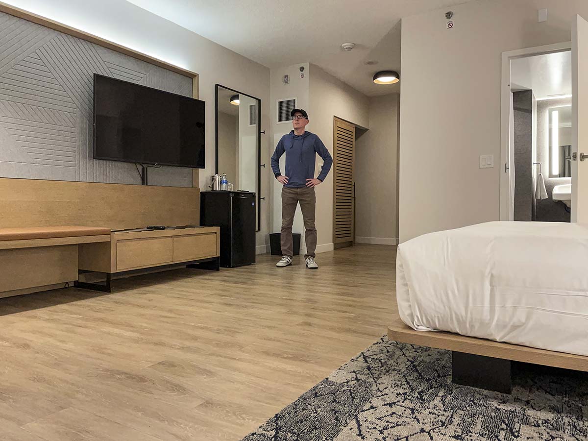 Scott standing in his room at the Sheraton YYZ Hotel