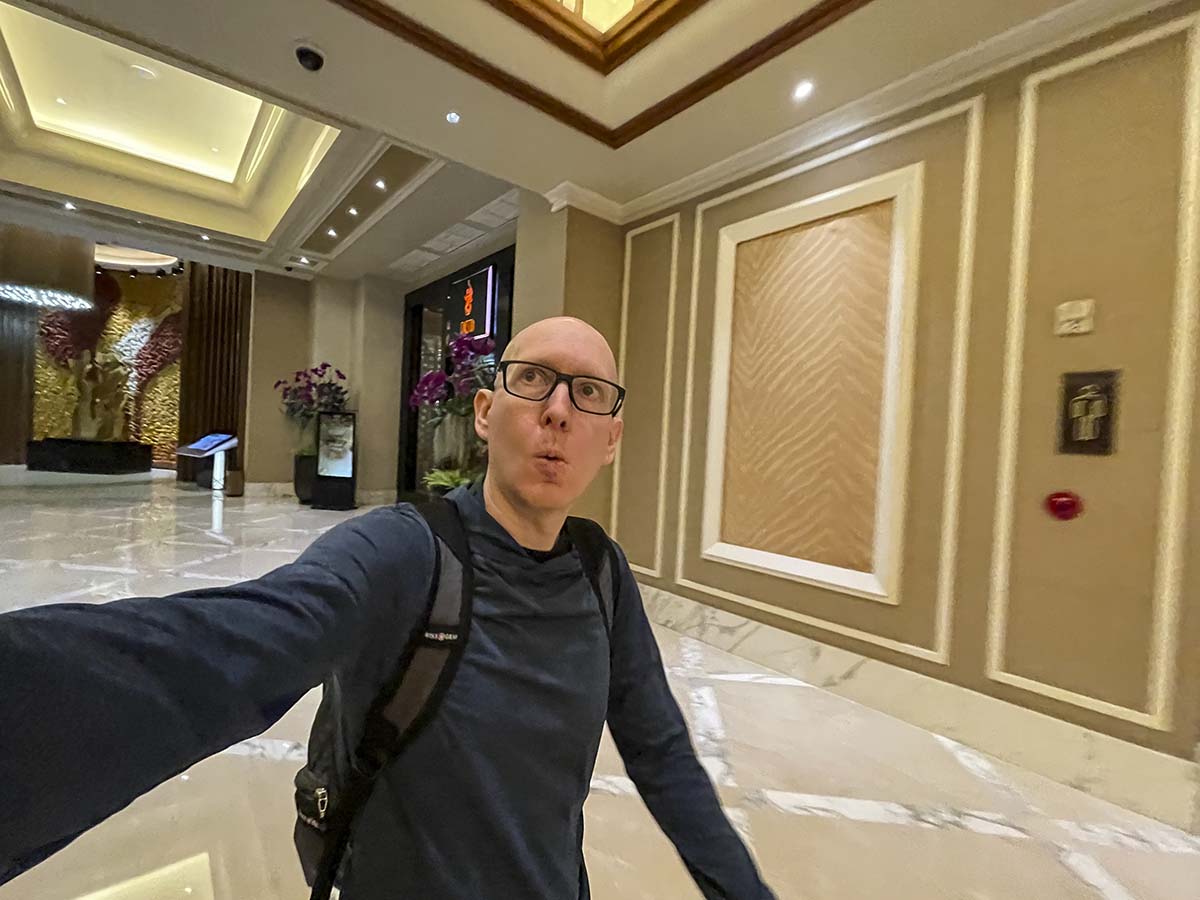 Scott walking through the lobby of the Solaire Manila 