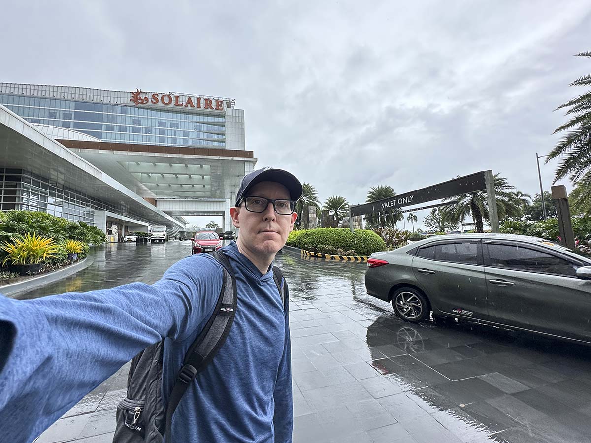 Scott standing outside of the main entrance to the Solaire Hotel Manila 
