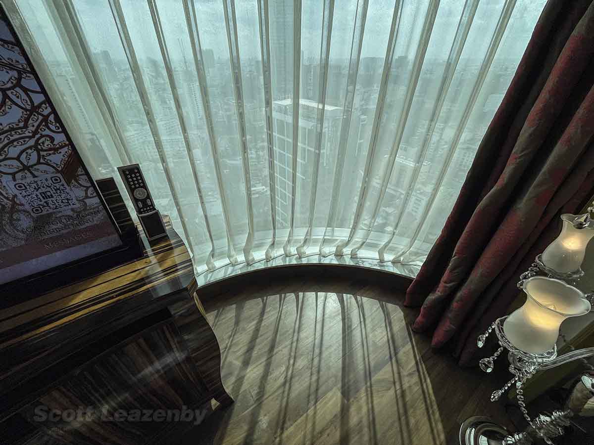 The Reverie Saigon Hotel panoramic room curved window