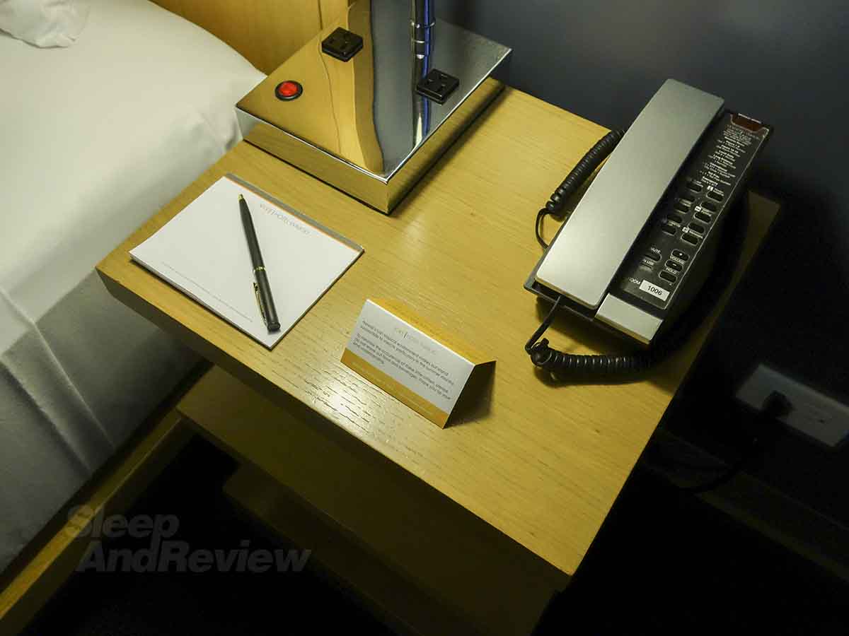 Vive Hotel Waikiki bed side table and phone