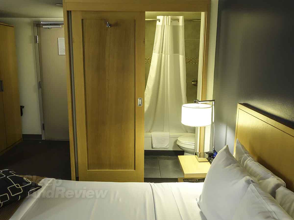 Vive Hotel Waikiki bed and bathroom