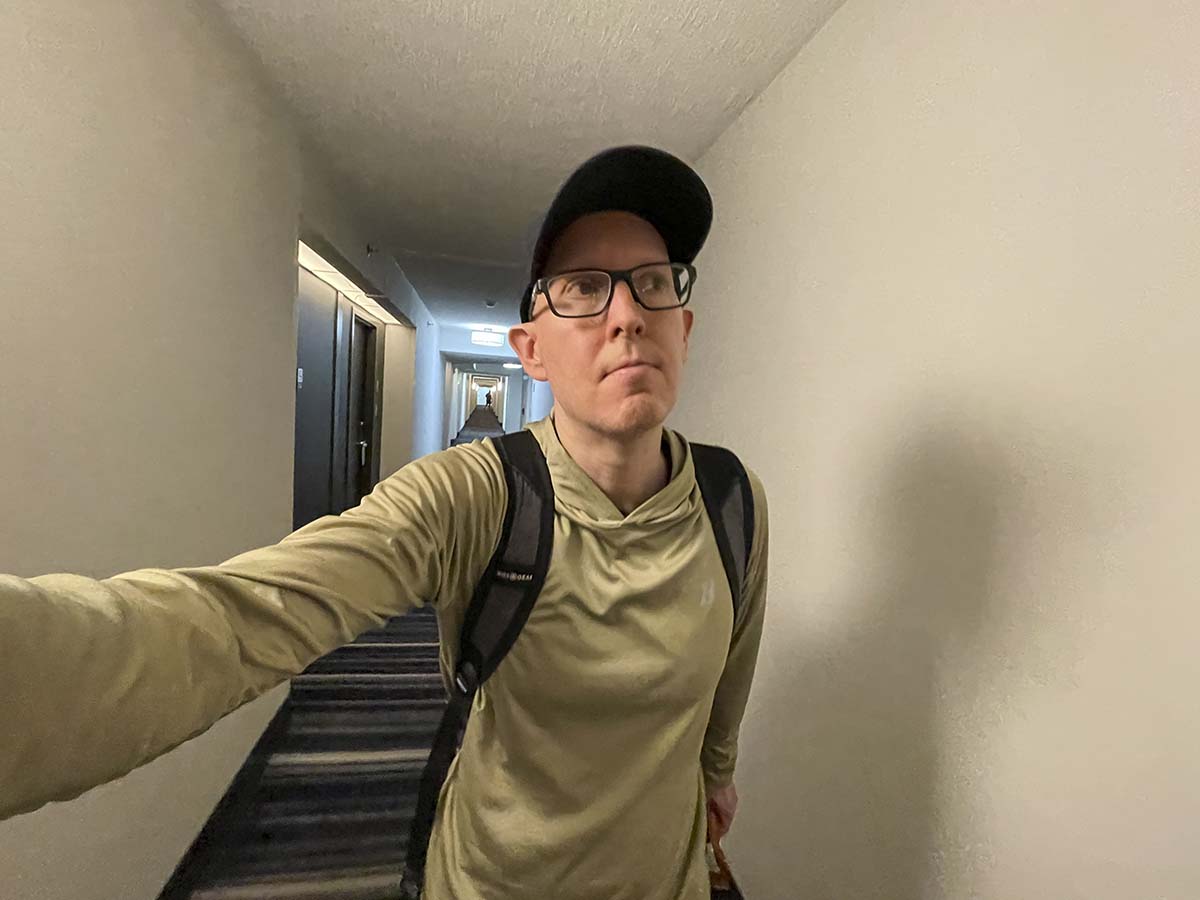 Scott walking down the hallway leading to his room at the Marriott Newark Airport 