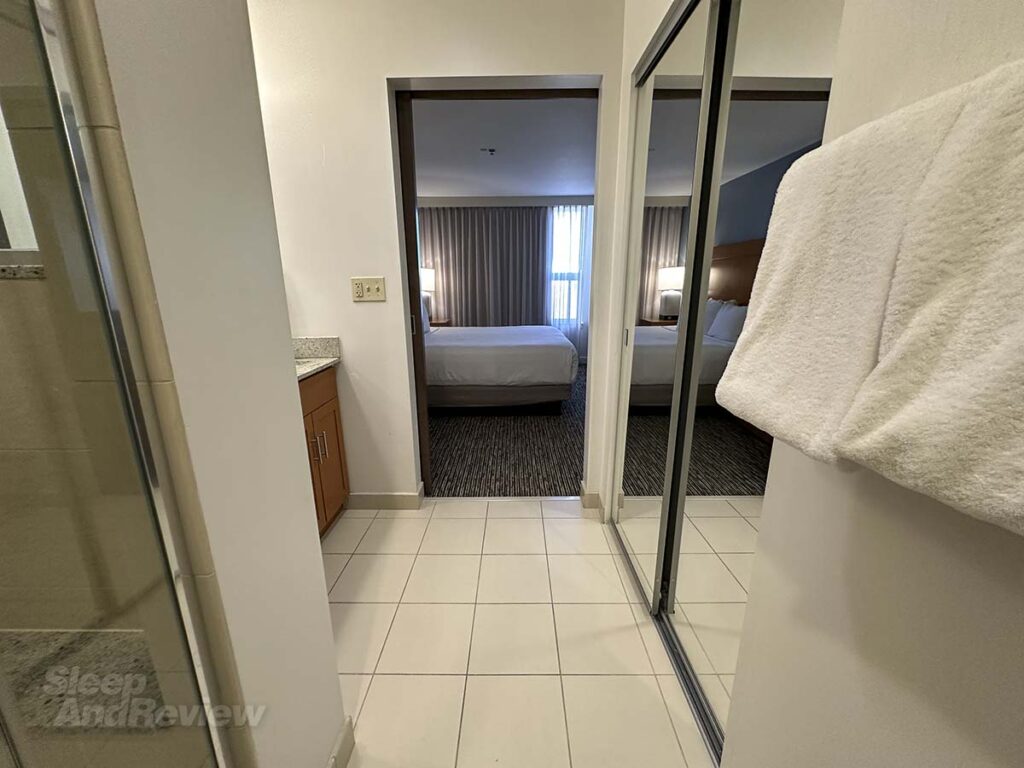 Hyatt House Denver Airport bathroom door leading to bedroom