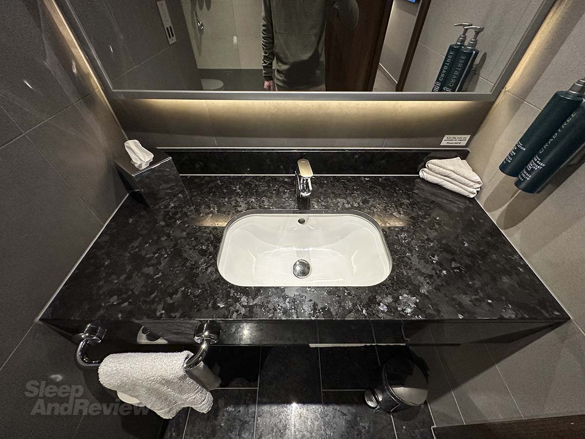 Sink and vanity mirror in the bathroom in my room at the Hilton Garden Inn Heathrow Airport