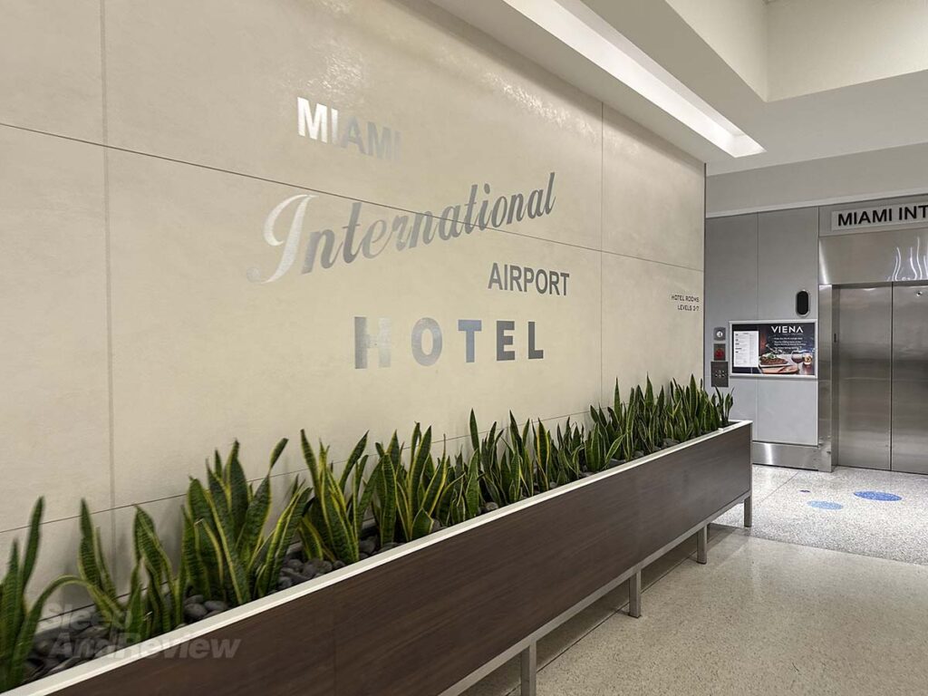 Miami International Airport hotel signage next to the elevators