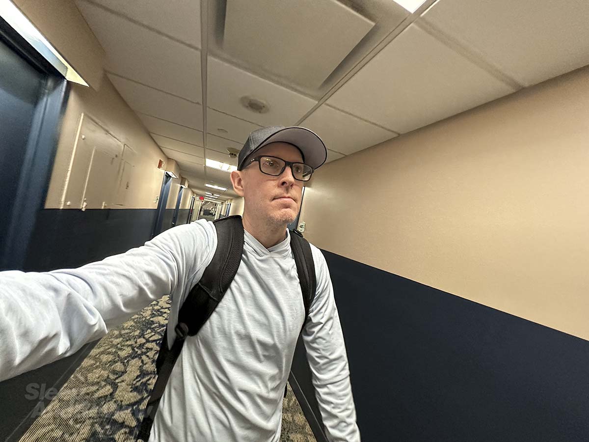 Scott Leazenby walking down the fourth floor hallway to his room at the Miami International Airport hotel