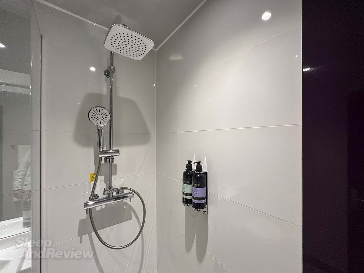 Showerhead and soaps in the shower  in my Premiere Plus room at the Premier Inn London County Hall Hotel