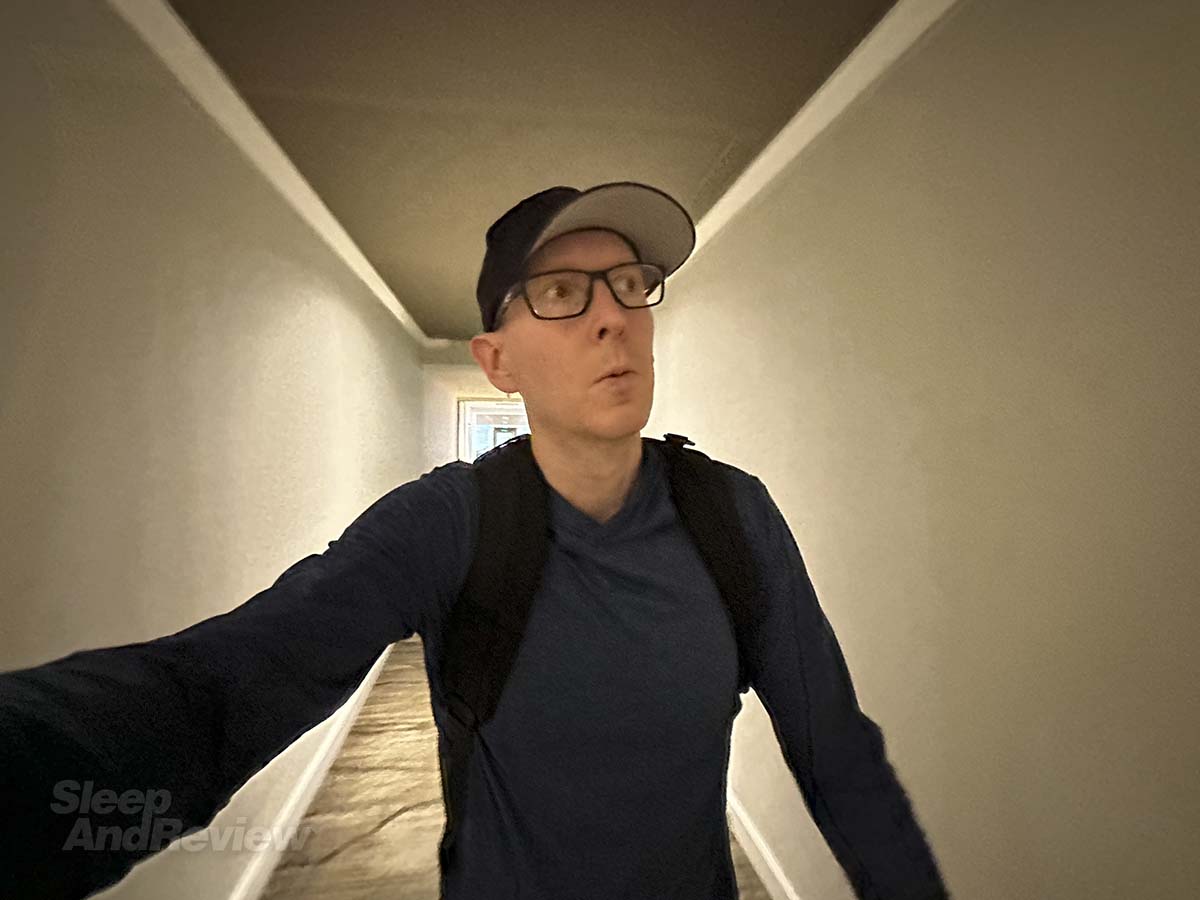 Scott Leazenby walking down the 5th floor hallway to his room at the Inverness Denver