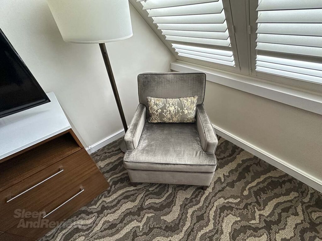 Side chair and lamp next to the TV in my studio suite at the Denver Inverness Hotel