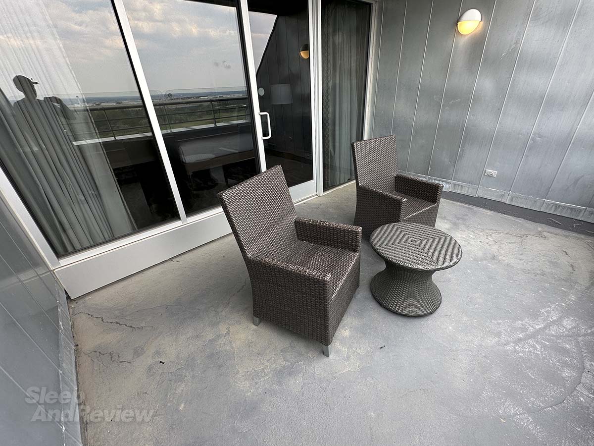 Table and chairs on the balcony in my studio suite at the Inverness Denver hotel