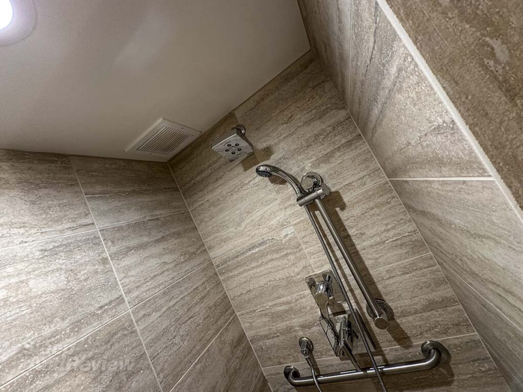 Showerhead and shower controls in the bathroom in my room at the Inverness Denver hotel