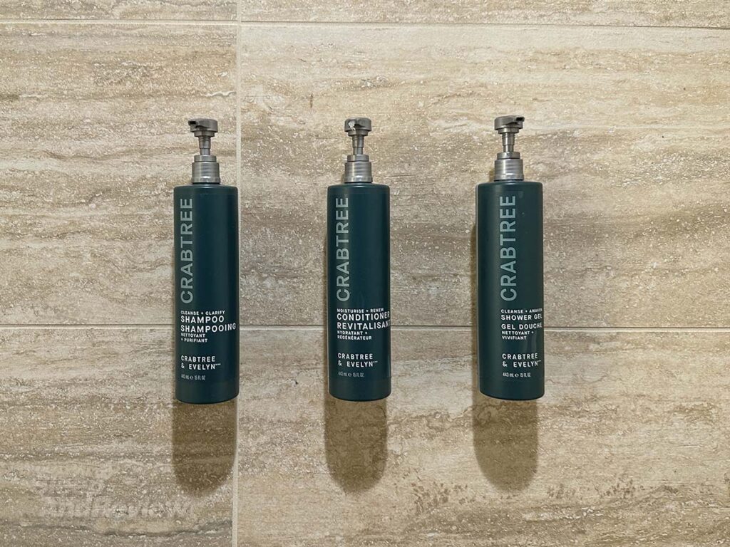Crabtree soaps, shampoos, and body wash in the shower in my room at the Inverness Denver Hotel
