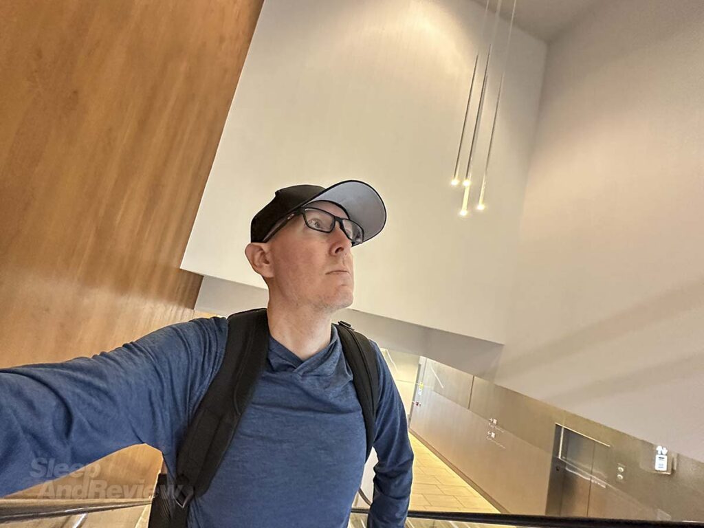 Scott Leazenby riding the escalator leading up to the lobby Westin hotel Denver airport