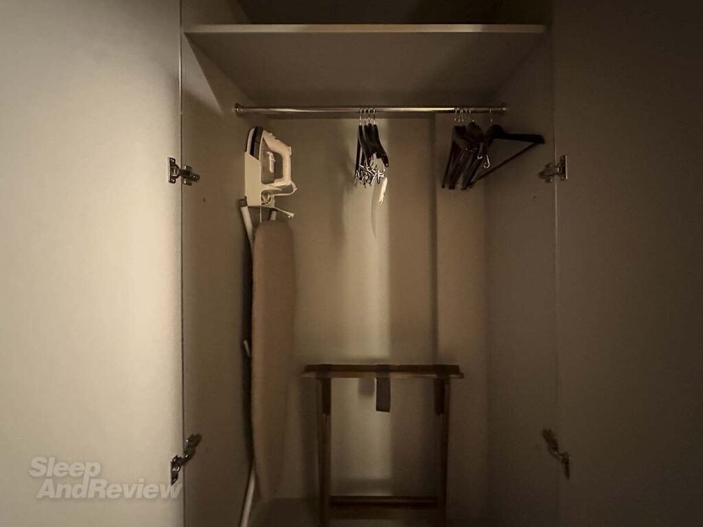 Closet with ironing board, iron, and hangers in my room at the Westin Denver airport