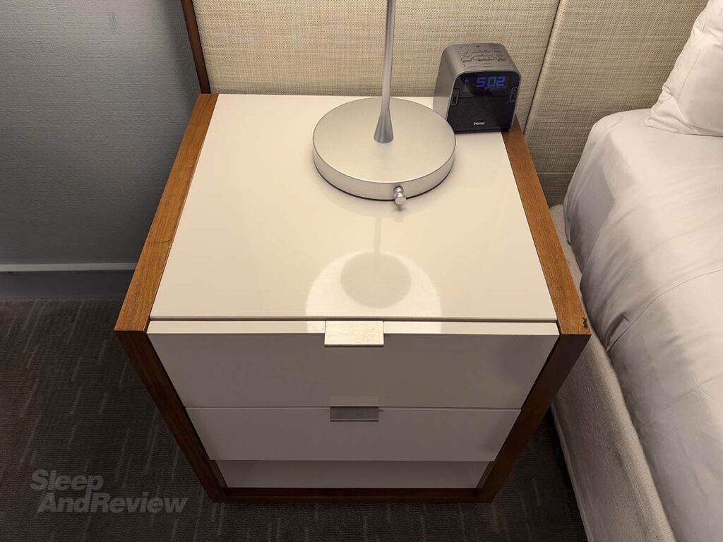 Bedside table with alarm clock in my room at the Hyatt Regency Waikiki Resort and Spa